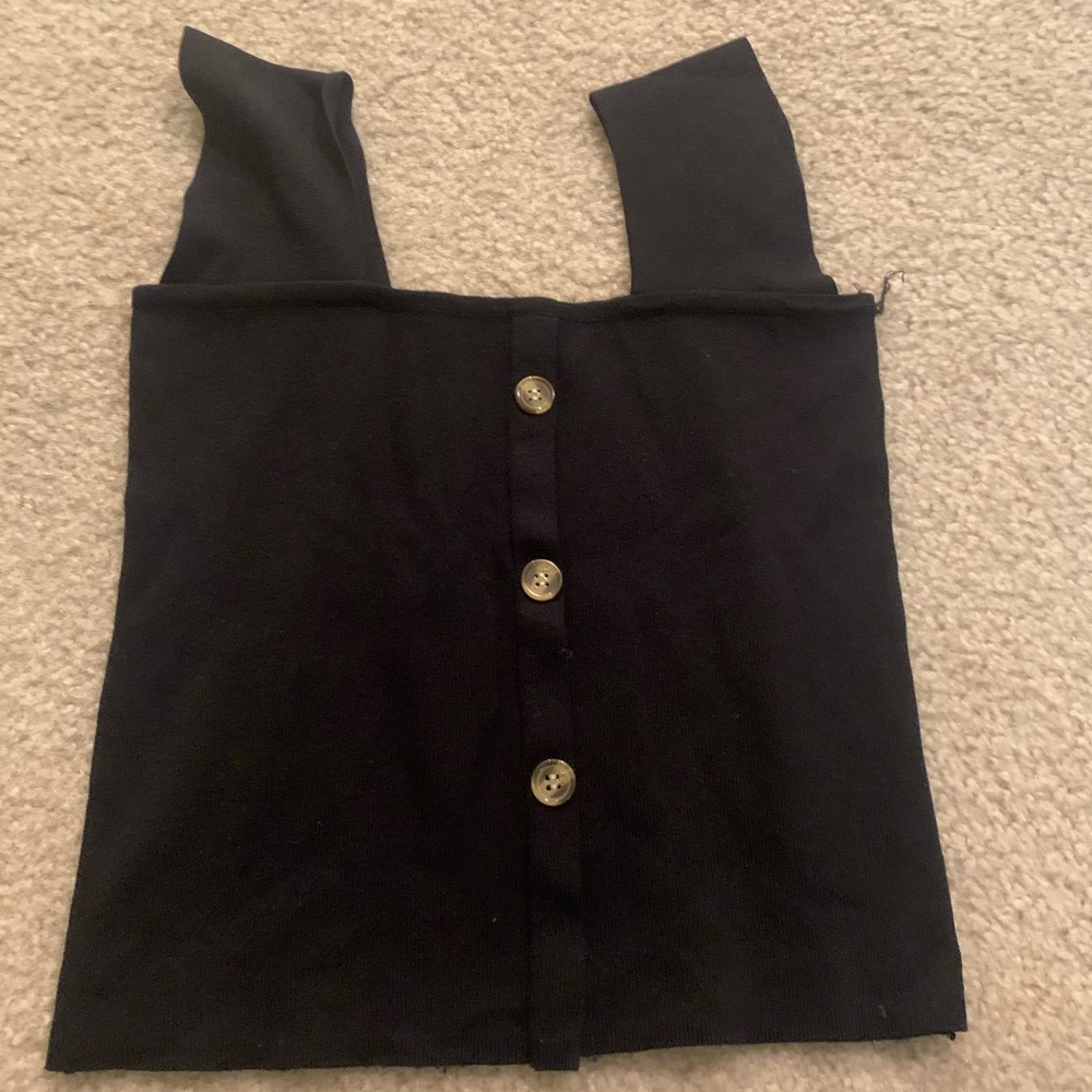 Black sleeveless knit top